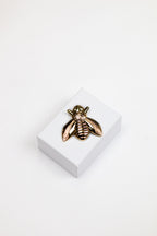 Broche Noi Goud